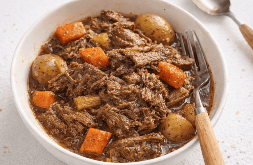 Delicious beef stew with tender meat, potatoes, carrots, and celery in a rich broth. Perfect comfort.